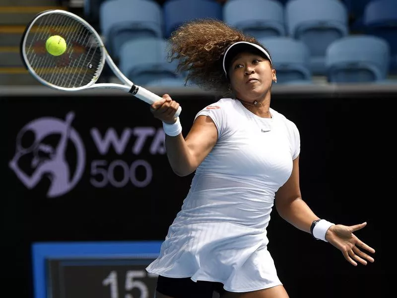Japan's Naomi Osaka makes a forehand return