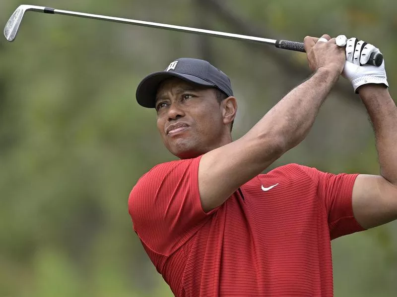 Tiger Woods watches his tee shot