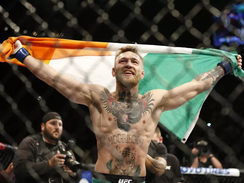 Conor McGregor reacts after defeating Jose Aldo