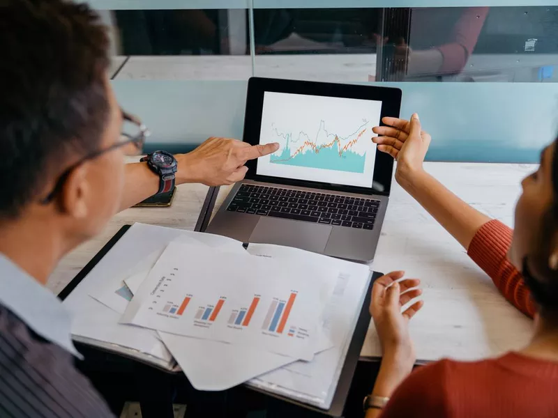 Asian business professionals working in office