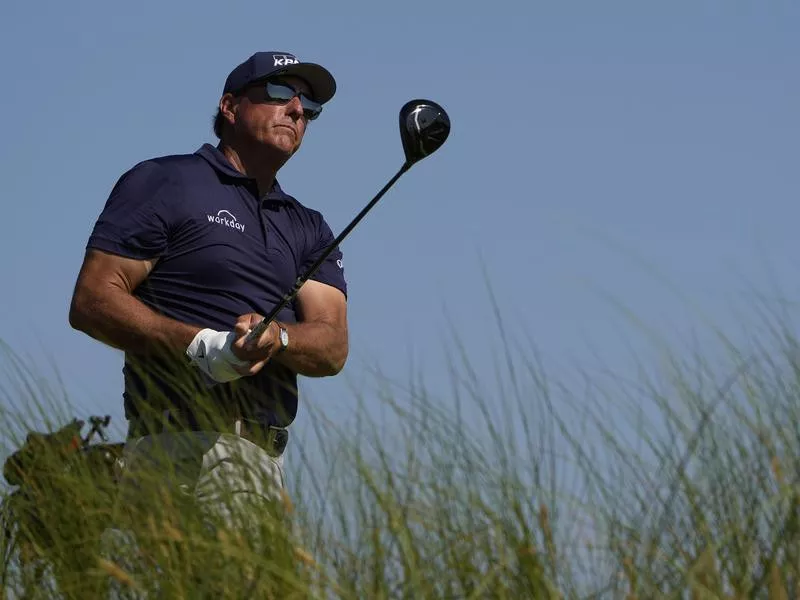 Phil Mickelson watches ball from eighth tee