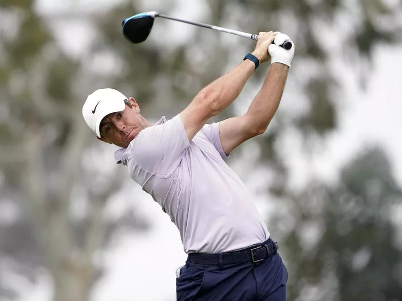 Rory McIlroy plays his shot