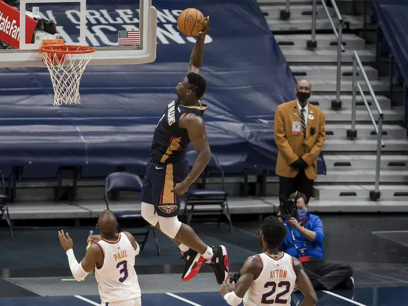 New Orleans Pelicans forward Zion Williamson dunks past Phoenix Suns