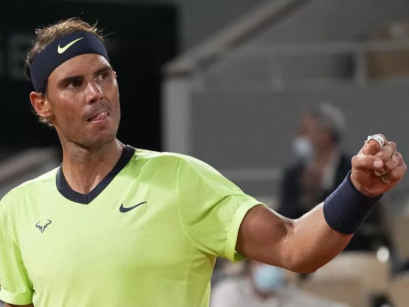 Spain's Rafael Nadal clenches fist as he plays Serbia's Novak Djokovic