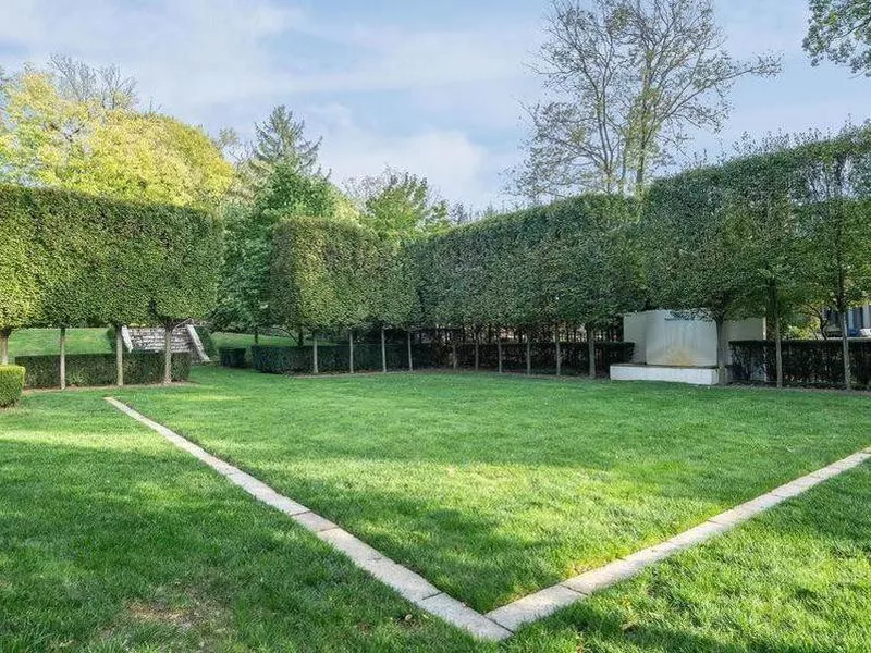 Yard with manicured and shaped trees