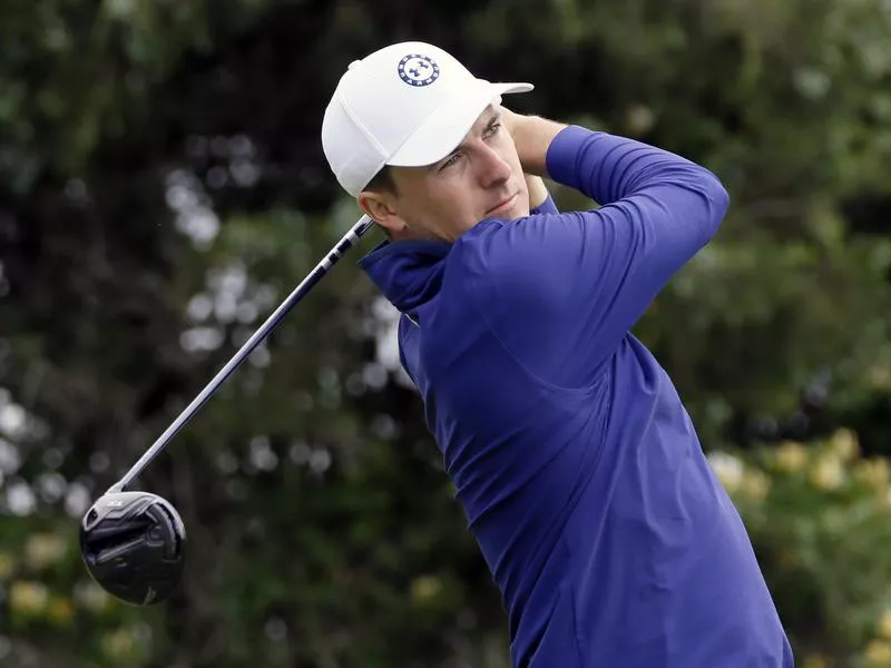 Jordan Spieth watches his tee shot