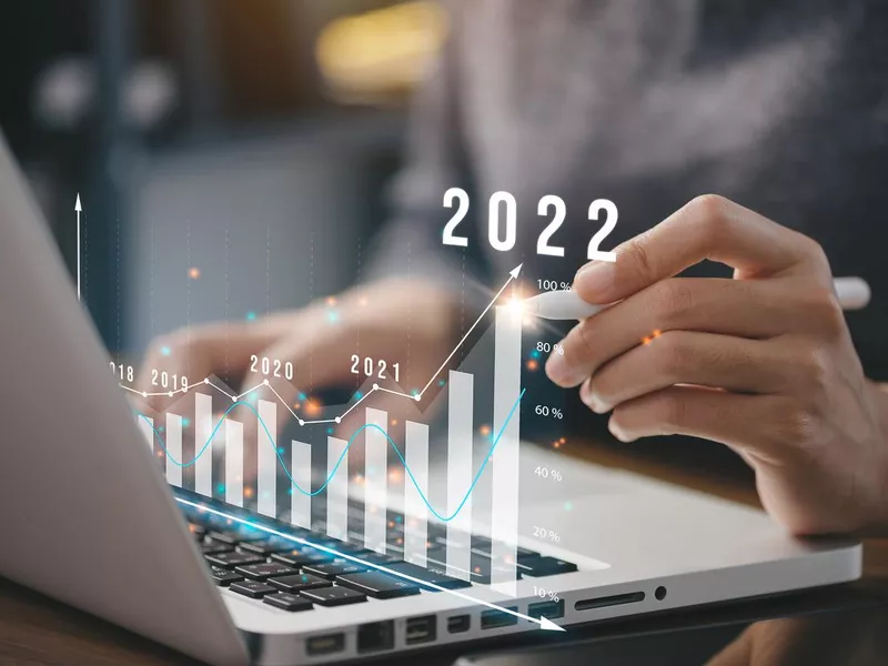 Businessman plan business growth and financial, increase of positive indicators in the year 2022 to increase business growth and an increase for growing up business 