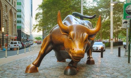 New York, USA - September 5, 2015: Charging Bull sculpture. The sculpture is both a popular tourist destination, as well as "one of the most iconic images of New York".